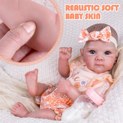 Aori Reborn Baby Doll Girl featuring rosebud lips for gentle realism.