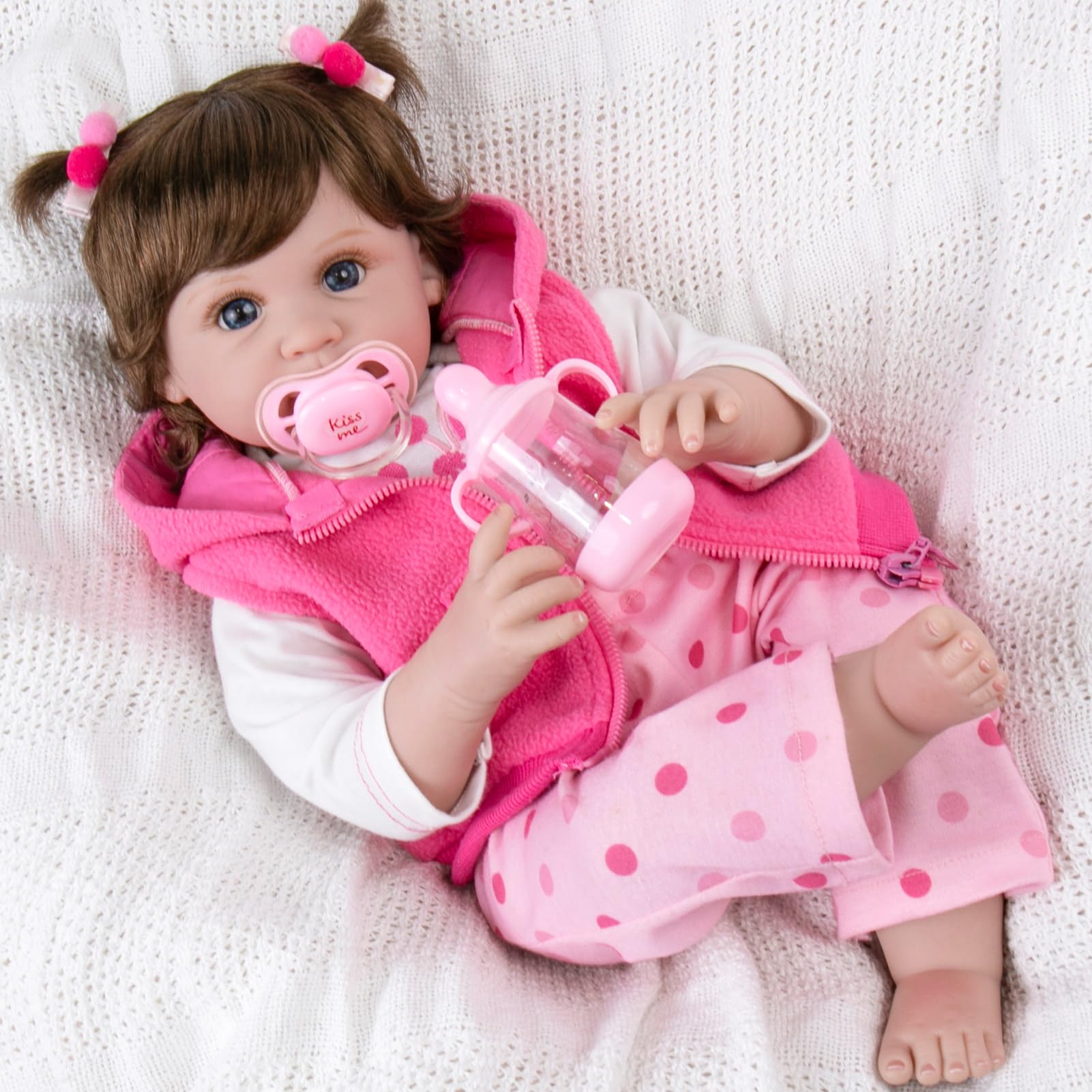 Aori Reborn Doll features hand-painted blushing and lashes for lifelike newborn look.