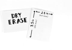 Family game night setup with Apostrophe Games dry erase cards and box.