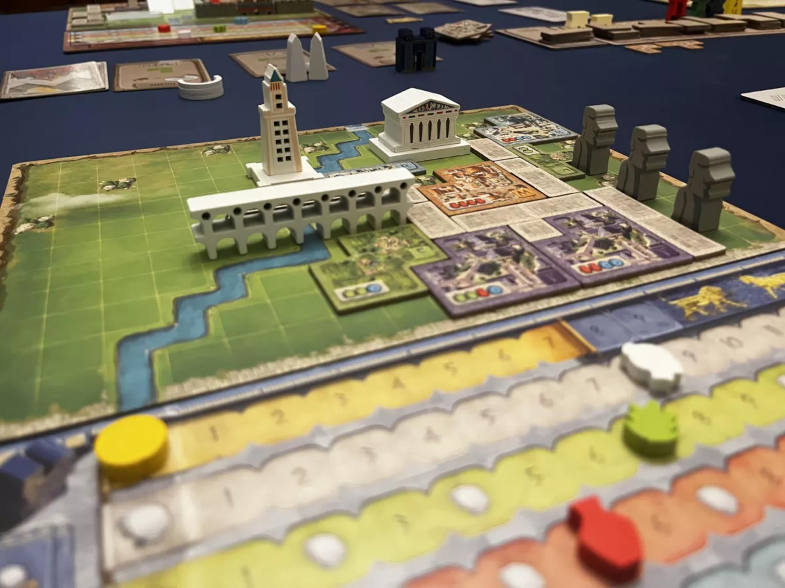 Arcane Wonders architect tiles highlight select constructions shaping resource flow.