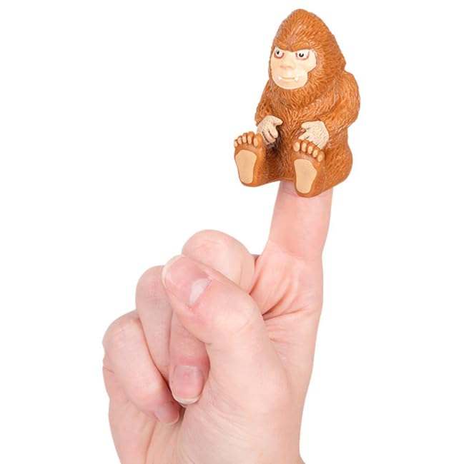 Archie McPhee Bigfoot finger puppet seated on a finger, great for playful storytelling.