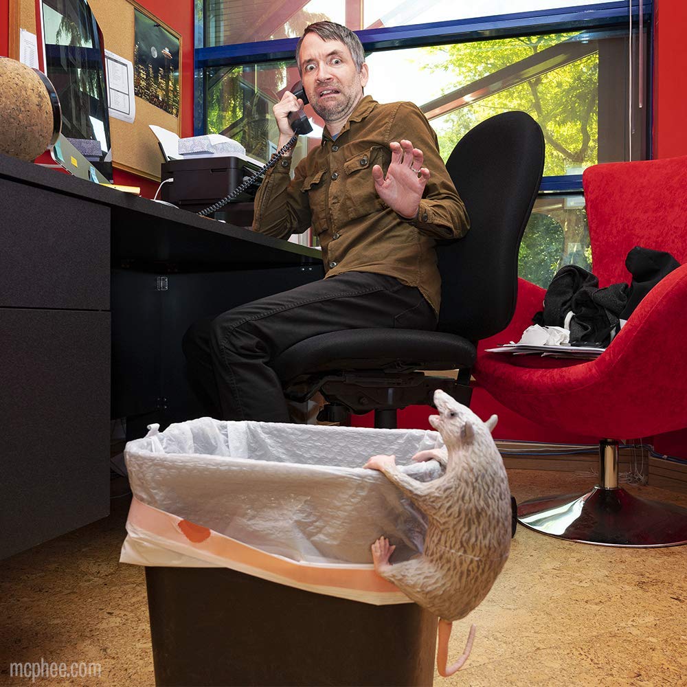 Archie McPhee Office Possum in an illustrated trash-can box design