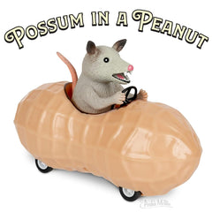 Archie McPhee possum in a peanut pull-back toy car side view showing compact 5-inch size.