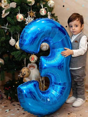 Giant blue 3 balloon by Argthjy used as backdrop for celebrations