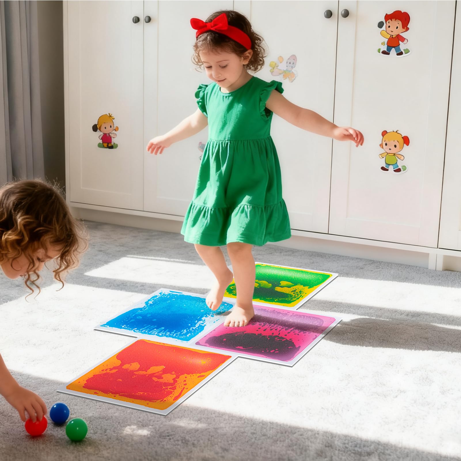 Art3d colourful liquid tiles arranged as a dance floor in a kids' room.