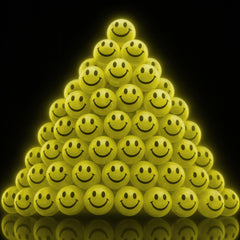 ArtCreativity glow-in-the-dark smiley bounce ball, 1 inch, ideal for nighttime active play.