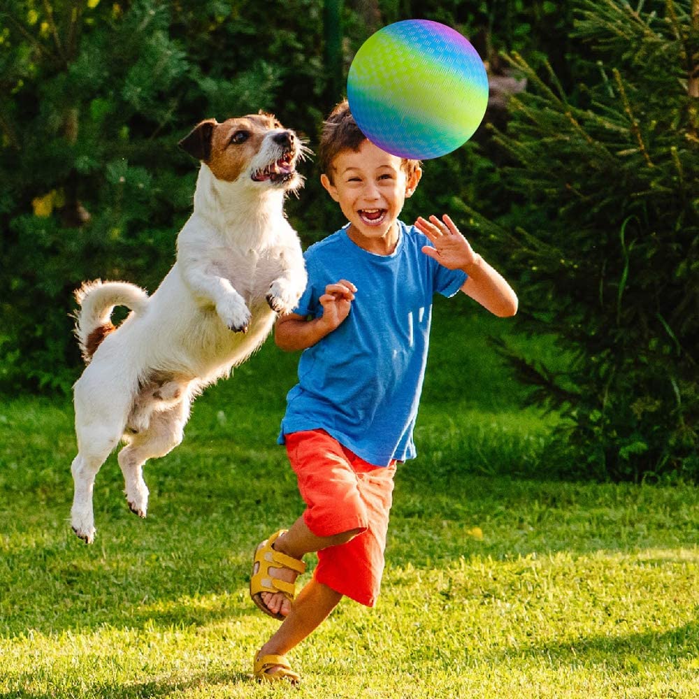 ArtCreativity rainbow playground ball in the park supports energetic outdoor fun.