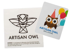 Artisan Owl foil balloon decor featuring a construction vehicle enhances party ambiance.