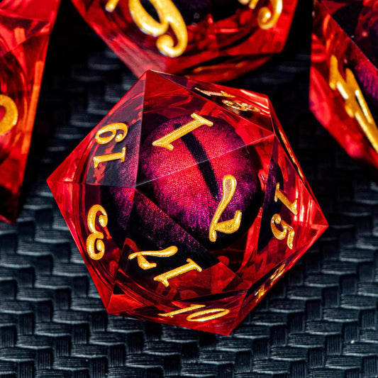 ARUOHHA Dragon Eye dice with liquid core in red resin, close-up detail