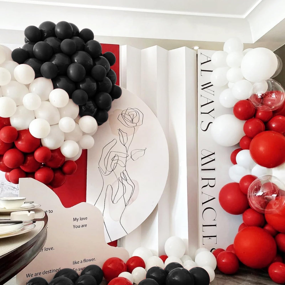 ASIYUHY birthday decor theme using red, black, and white balloons.