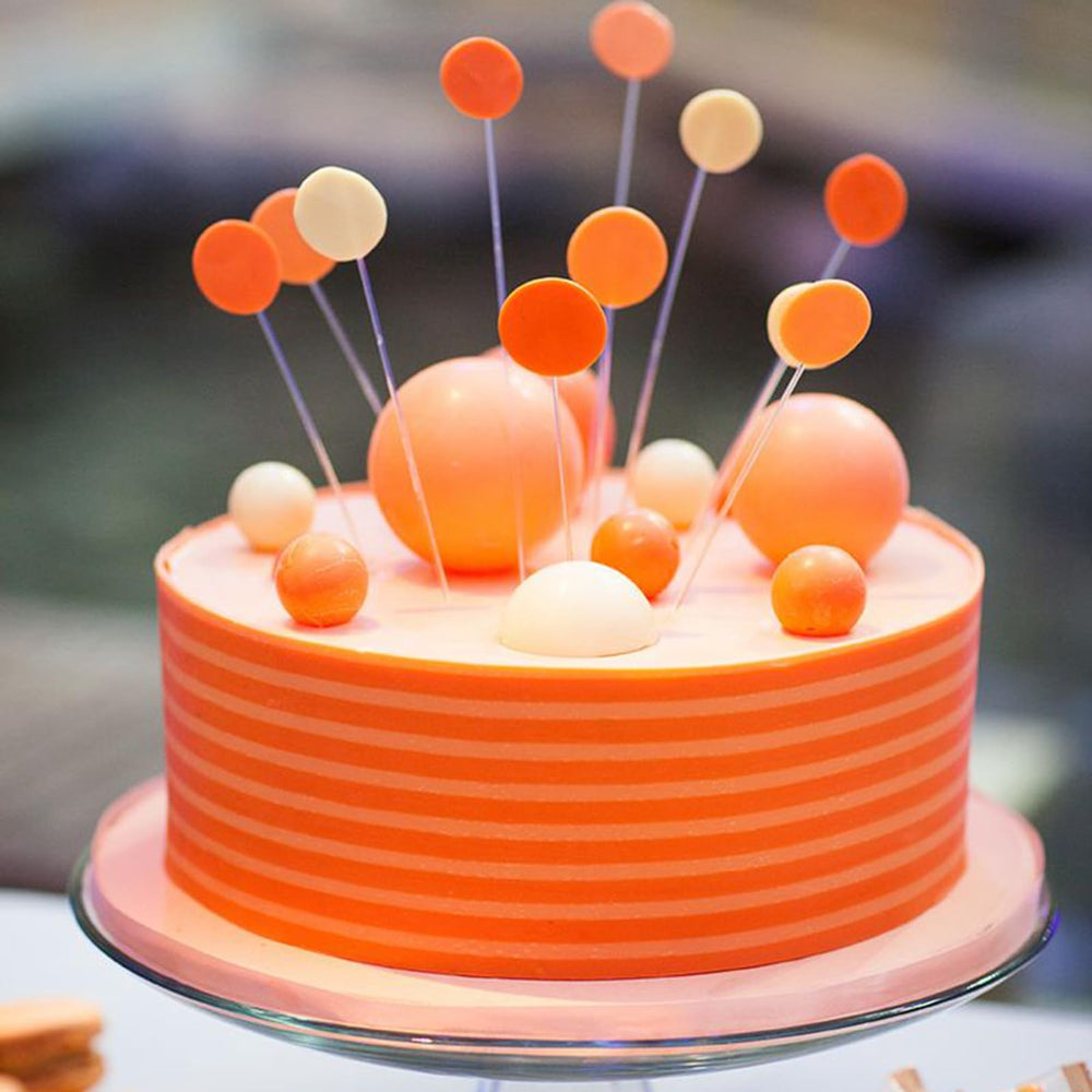 ASTARON orange ball toppers with wire stems for easy insertion.