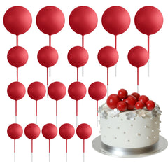 ASTARON red ball cake topper on a cake for birthday celebration.