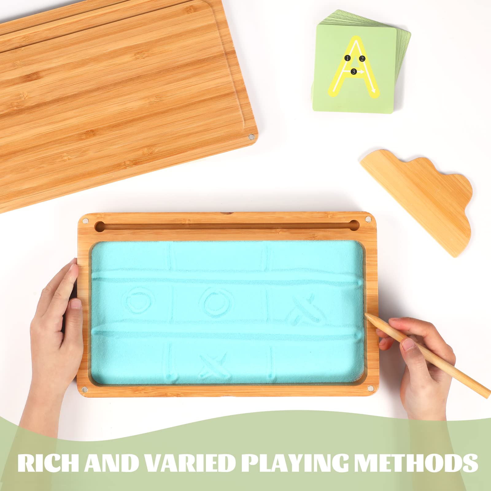AtMini sand tray with letter cards promotes early literacy through tactile learning.