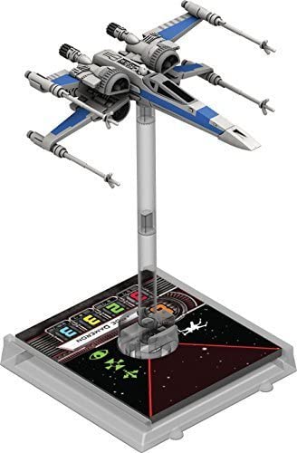 Two-player battle setup with Atomic Mass Games X-Wing core set for quick starts.