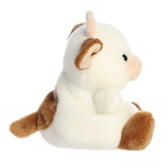 Aurora Caroline Brown Cow Palm Pal in hand, easy to cuddle.