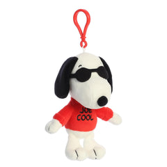 Aurora Adorable Peanuts Joe Cool clip-on stuffed animal on a bag for on-the-go fun.
