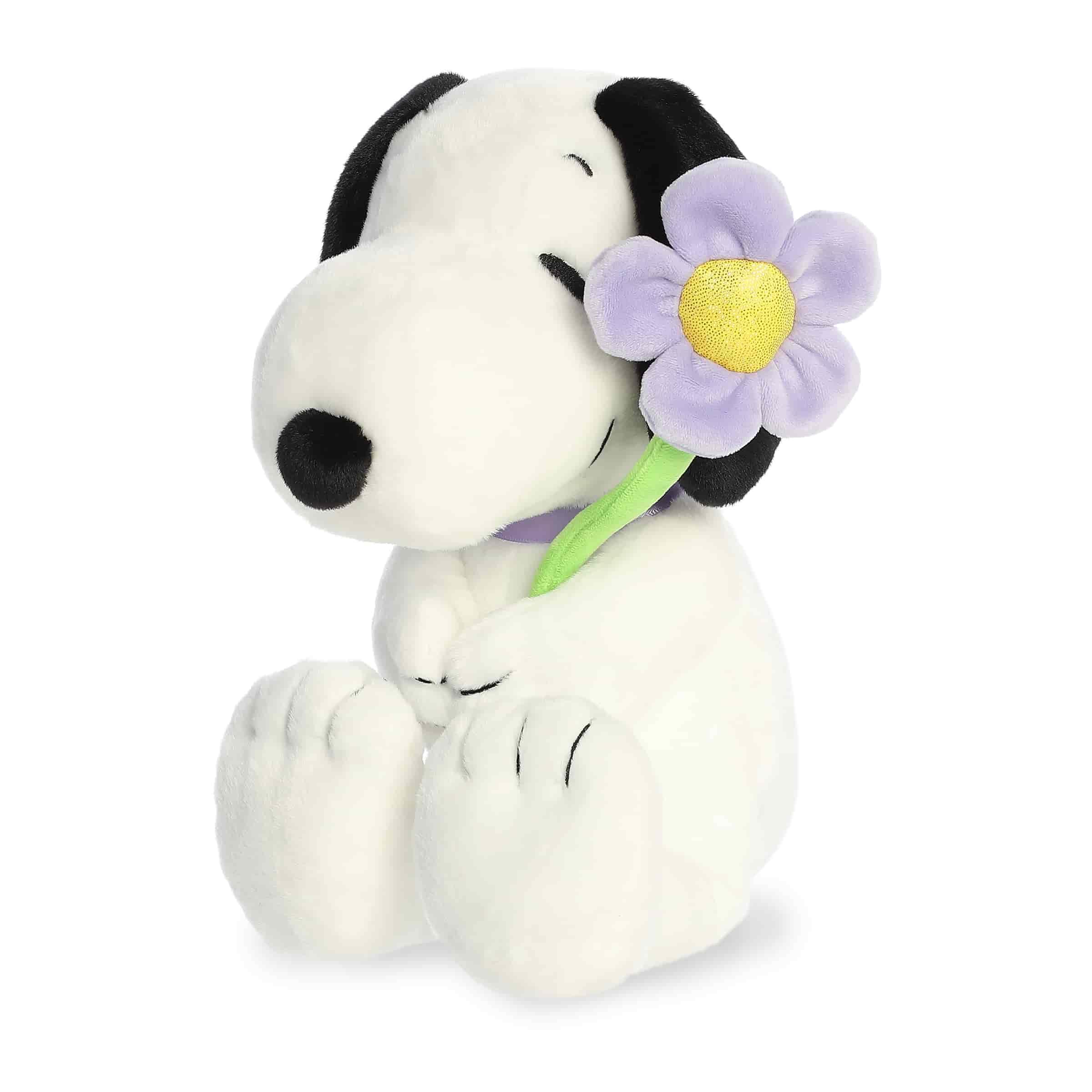 Aurora Adorable Peanuts Snoopy plush with purple flower offers soft cuddling.