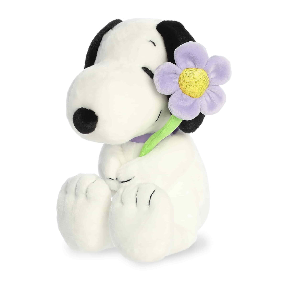 Aurora Adorable Peanuts Snoopy plush with purple flower offers soft cuddling.