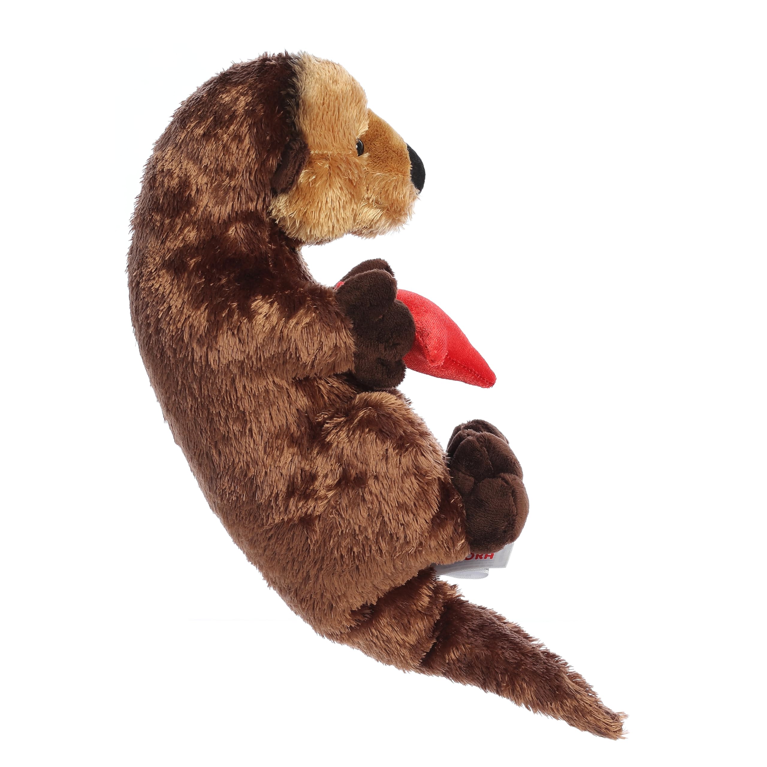 Aurora Cali Otter Flopsie lying on back for cozy cuddle play.