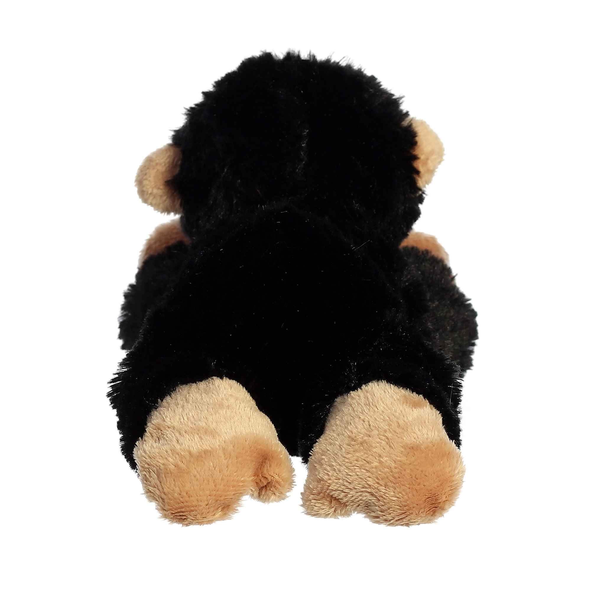 Aurora Cory Chimp Mini Flopsie in a cuddling pose supports imaginative storytelling during quiet evenings.
