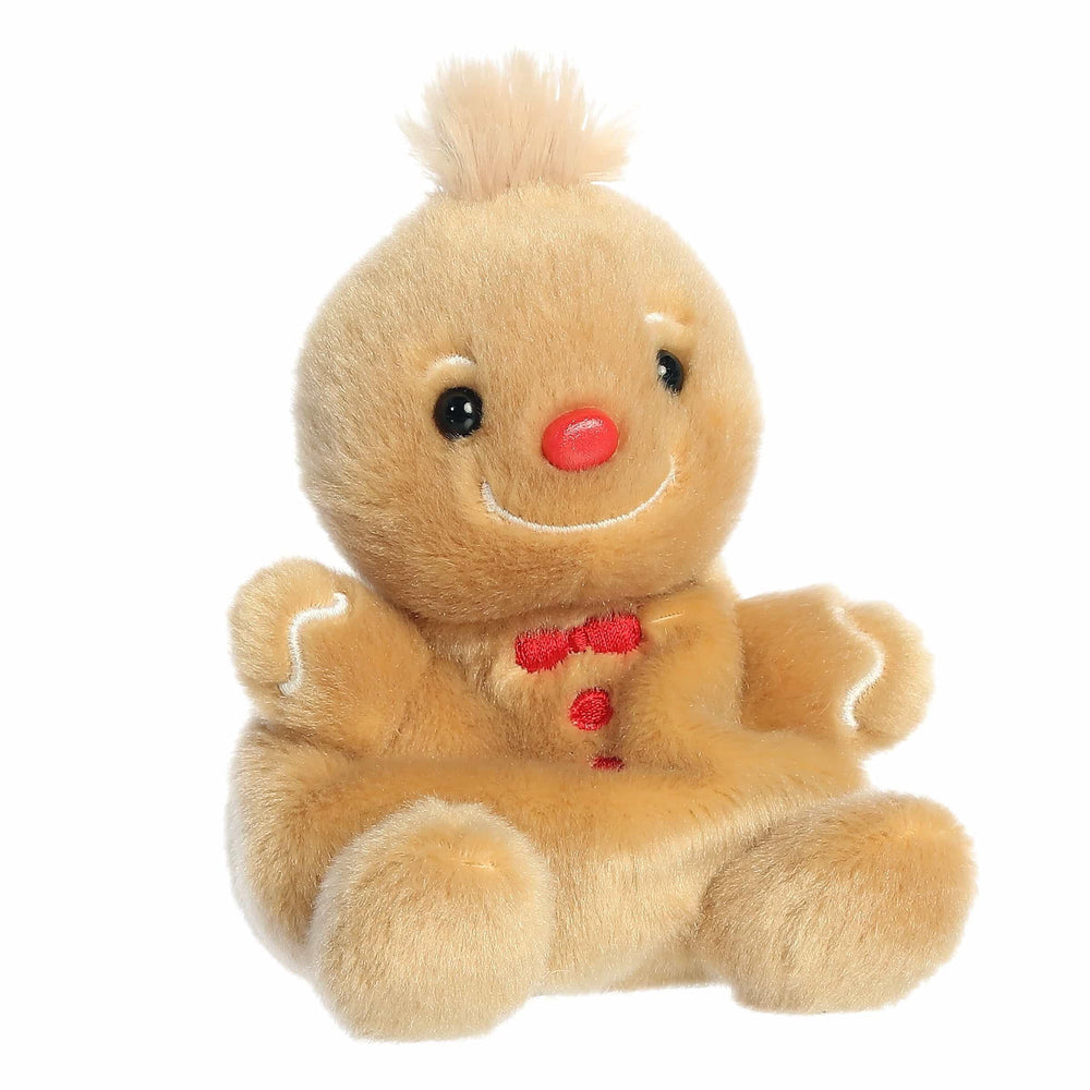 Aurora Festive Palm Pals Gino gingerbread plush adds festive decor to a shelf.