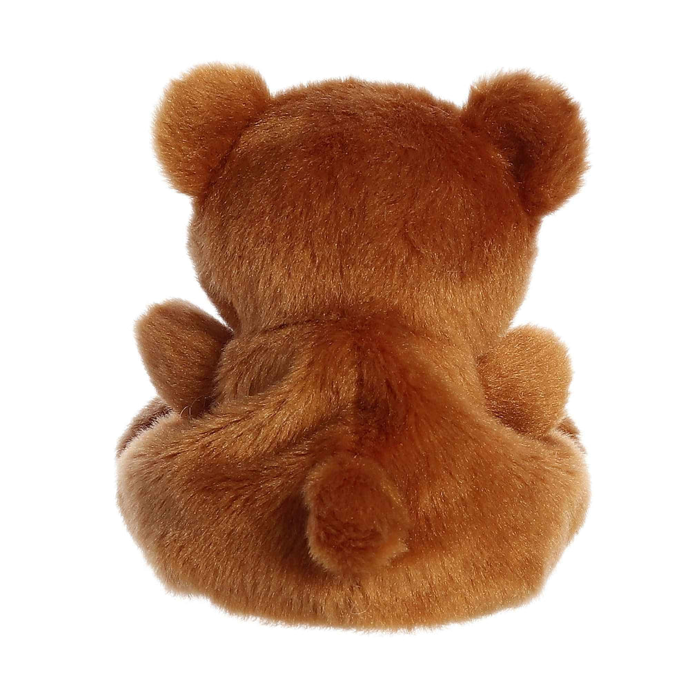 Aurora Artie Bear in hand, compact cuddly buddy for on-the-go