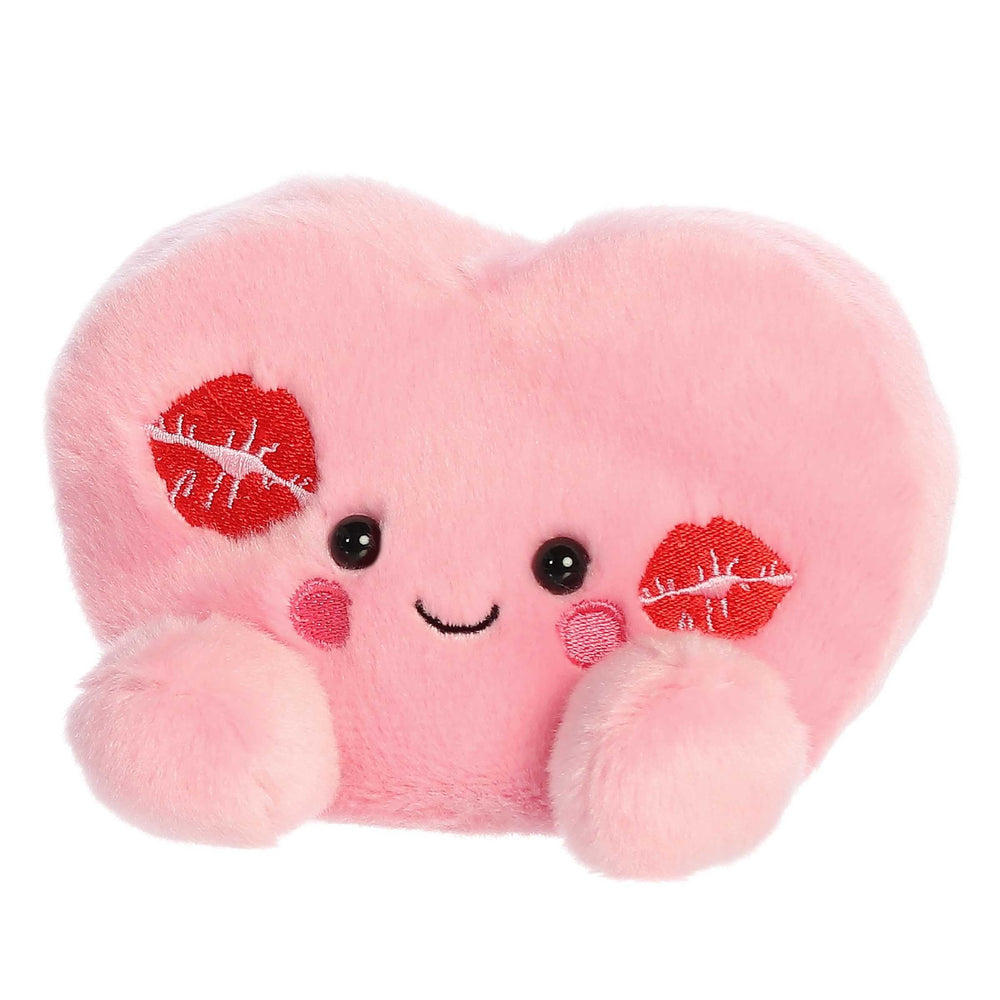 Aurora Kinsley Kisses Heart plush being hugged for comfort.