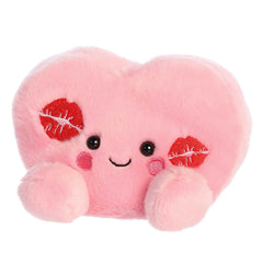 Aurora Kinsley Kisses Heart plush being hugged for comfort.