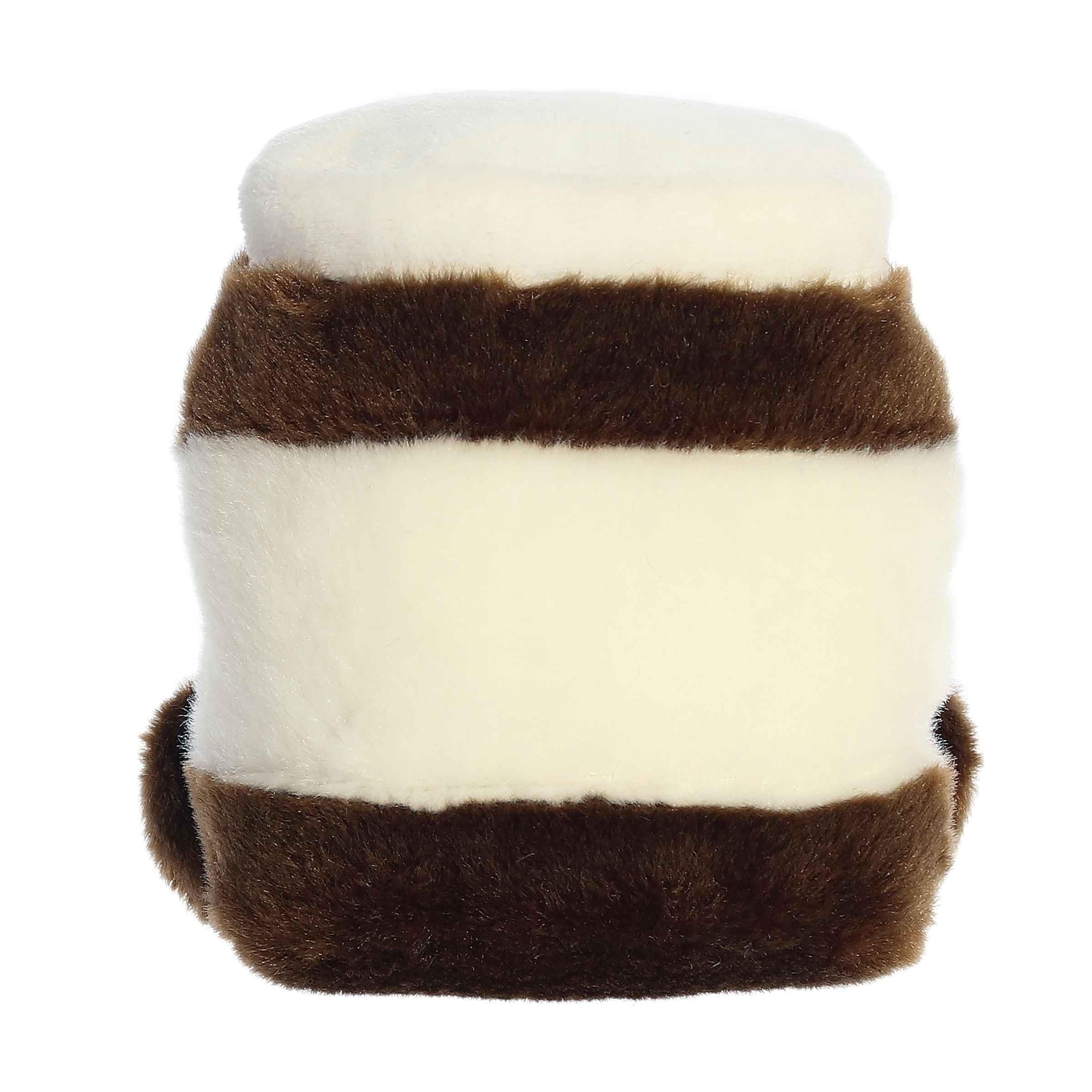 Aurora Palm Pals Silky Chocolate Spread plush on a shelf adds cozy room decor.