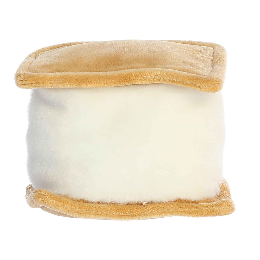 Aurora Palm Pals Toastee S'More plush on shelf, charming bedroom decor.