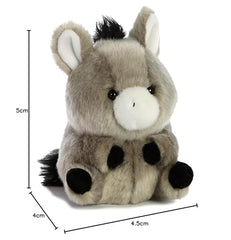 Aurora Bray Donkey plush in hand demonstrates portable on the go use.