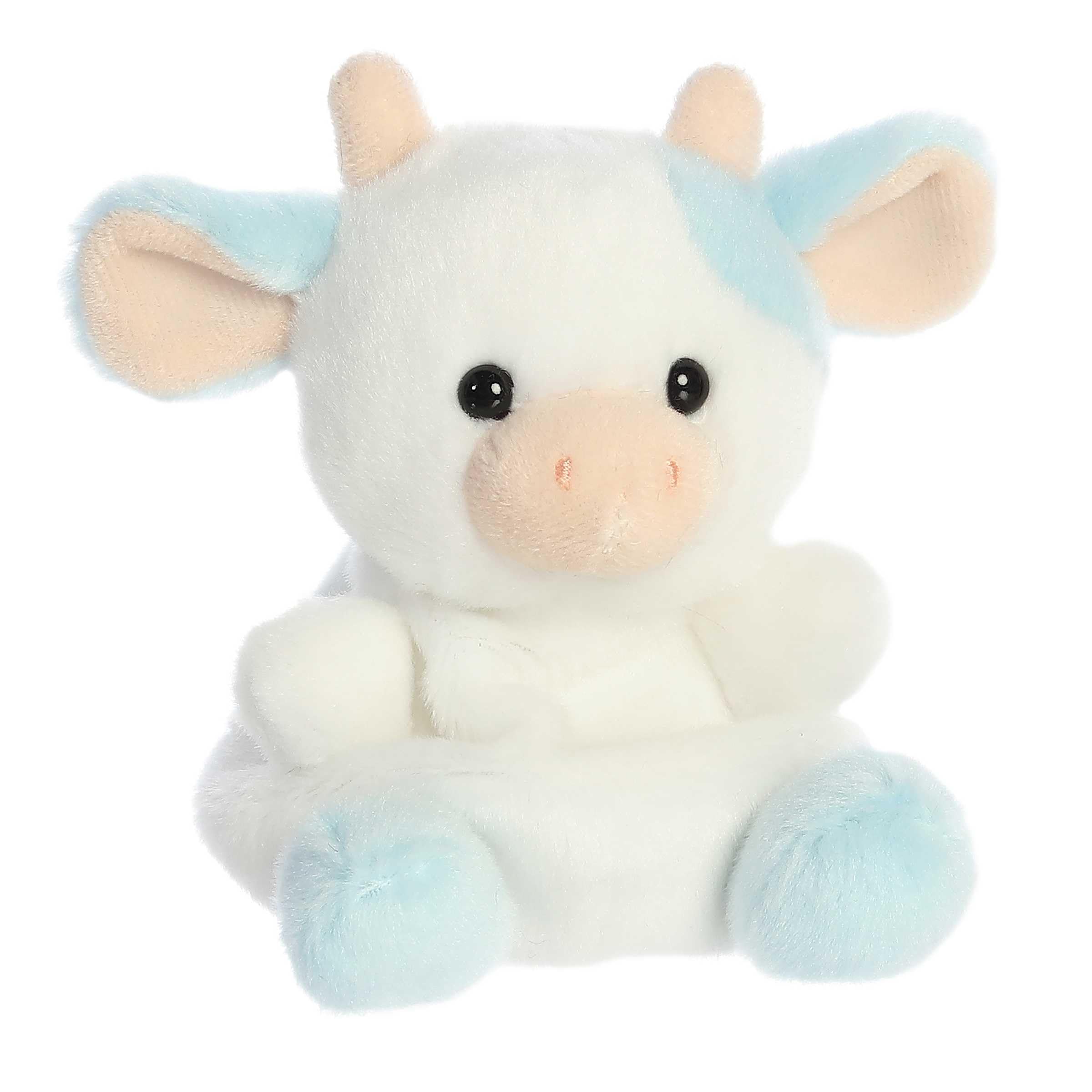 Aurora Skyla Blueberry Cow plush held in hand to emphasize palm sized design