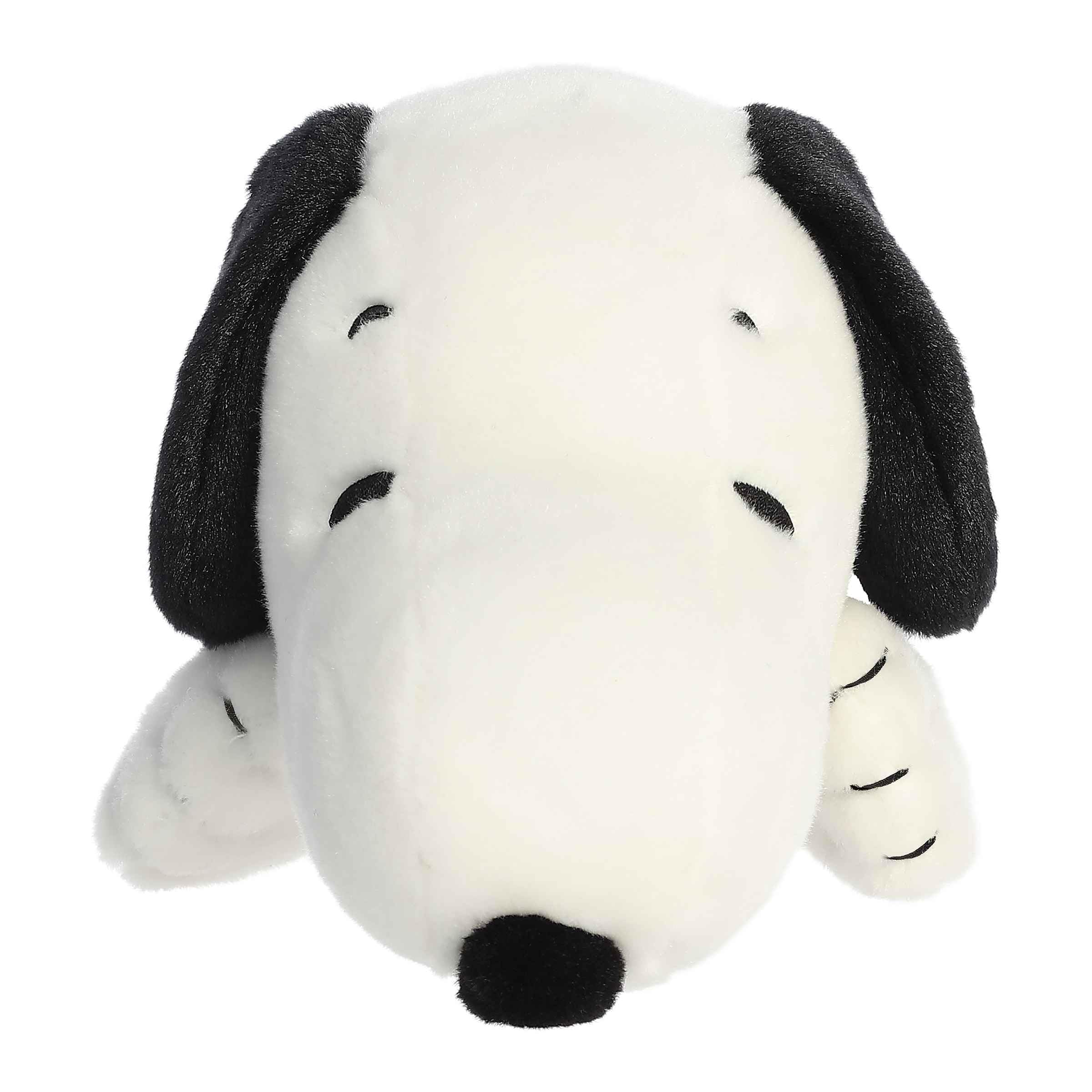 Aurora Snoopy plush toy in laying pose, ideal nostalgic gift for Peanuts fans.