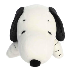 Aurora Snoopy plush toy in laying pose, ideal nostalgic gift for Peanuts fans.