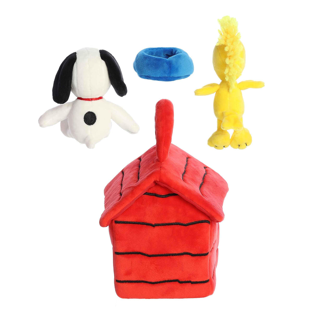 Aurora Woodstock figure accompanying Snoopy plush in the playset