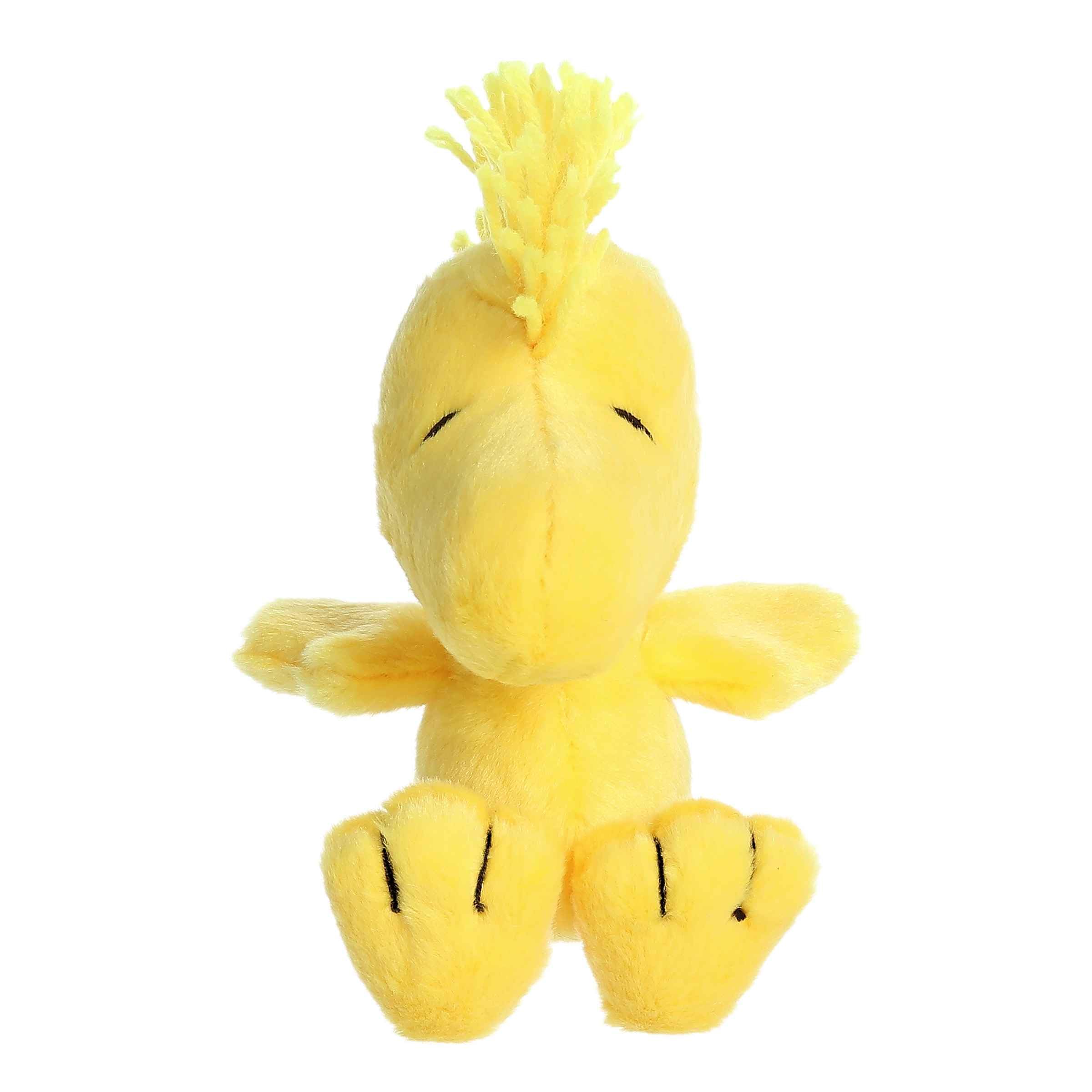 Aurora Woodstock plush showing bright yellow fabric and friendly face for cuddly play.