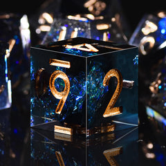 D20 and other dice with bold numerals and gold foil accents