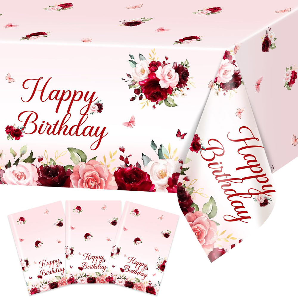 Avezano burgundy floral birthday tablecloth 108x54 on table for spill protection.