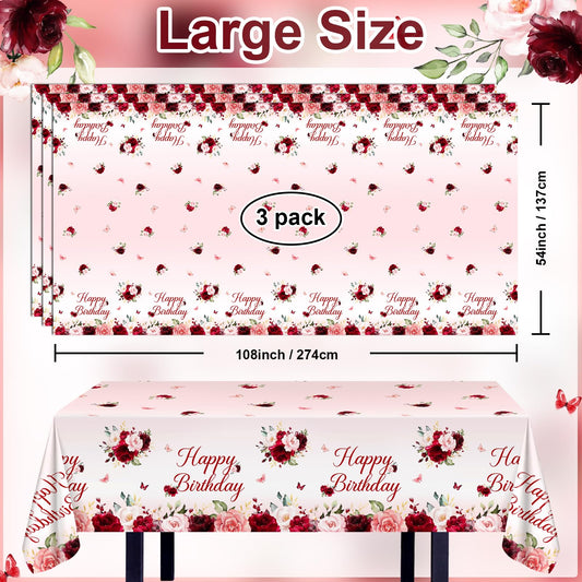 Elegant burgundy and pink floral print enhances birthday table settings.