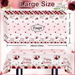 Elegant burgundy and pink floral print enhances birthday table settings.