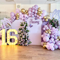 Awenztech gender reveal setup using light purple balloons for suspenseful reveal.