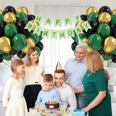 Awenztech jungle safari backdrop ideas with green and gold balloons.