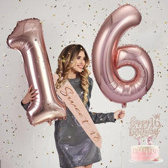 Awfrky rose gold 16 balloons creating a chic backdrop for photos