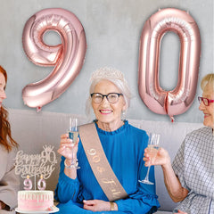 Awfrky rose gold numeral candles provide long-lasting ambient light.