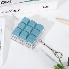 Gift-ready packaging of the Axlksia keyboard fidget toy.