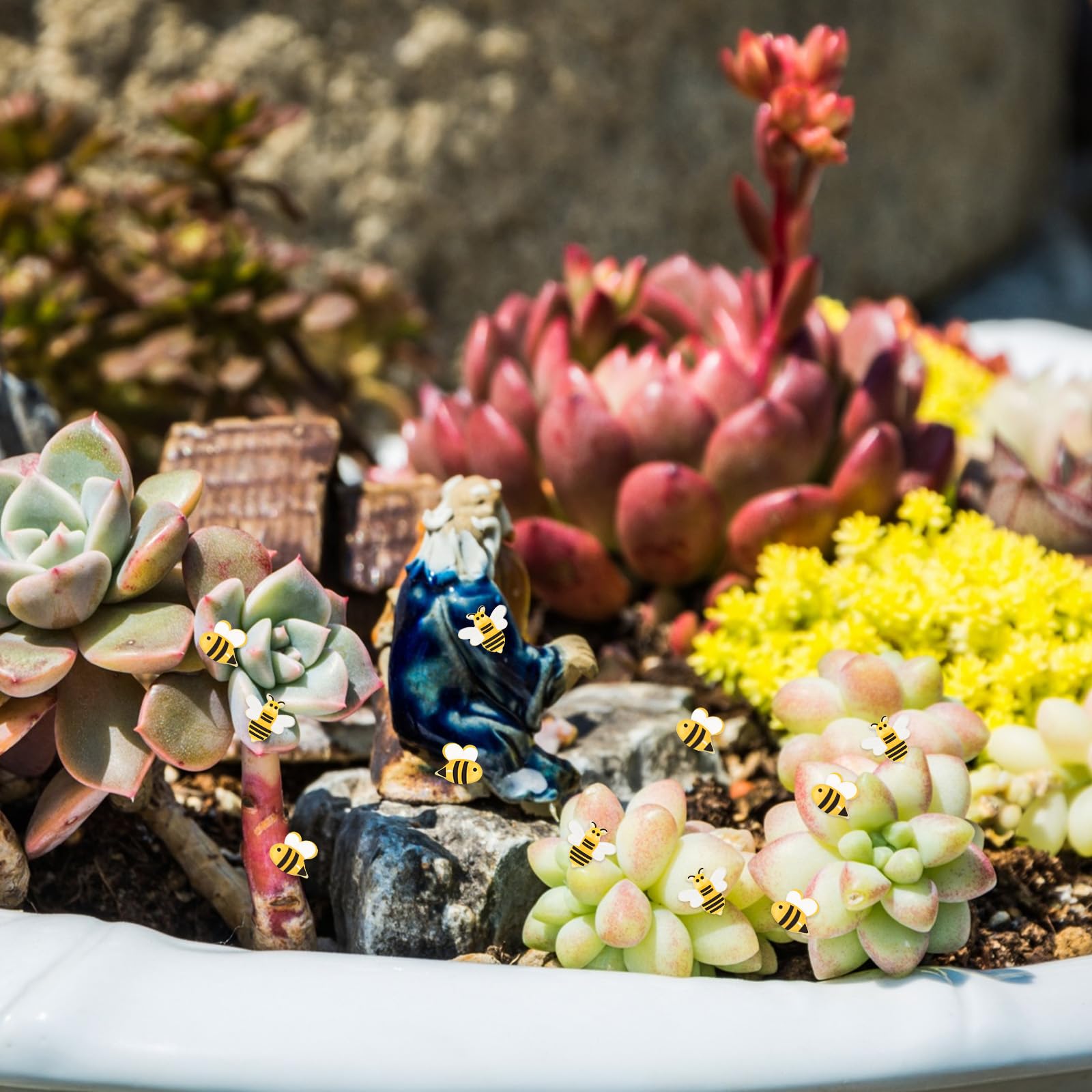 Azefnuhk side mini bee detail enhances tiny mosaic and container gardens.