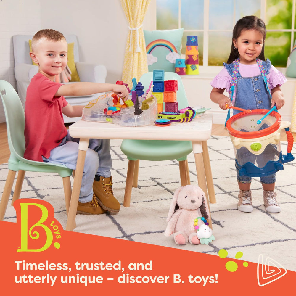 B. toys Alpha B. Tical in action: tiny hands place letters on the board.