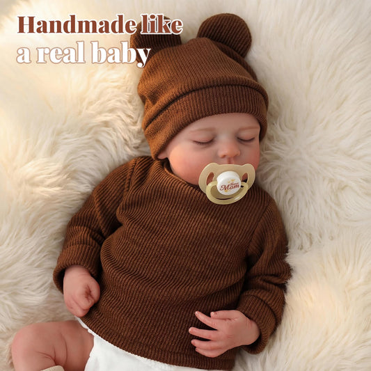 BABESIDE Reborn Baby Doll Boy wearing bear hat enhances imaginative nurturing.