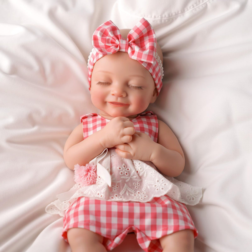 Includes clothes, diaper, bottle with BABESIDE silicone doll