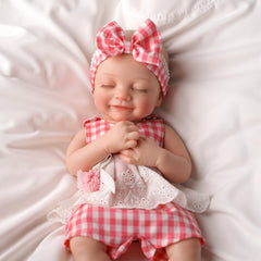 Includes clothes, diaper, bottle with BABESIDE silicone doll